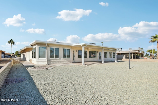 rear view of property featuring a patio