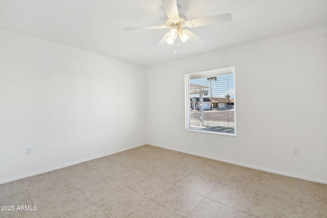 spare room with ceiling fan