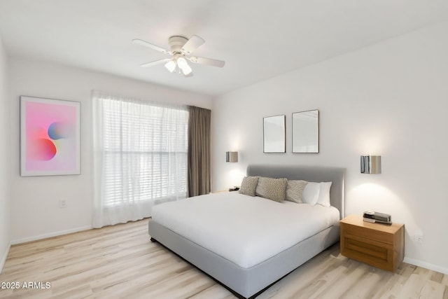 bedroom featuring ceiling fan and light hardwood / wood-style floors