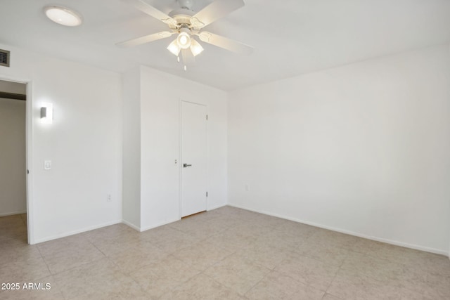 unfurnished bedroom featuring ceiling fan and a closet