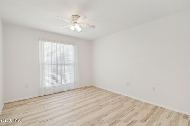 unfurnished room with ceiling fan and light wood-type flooring