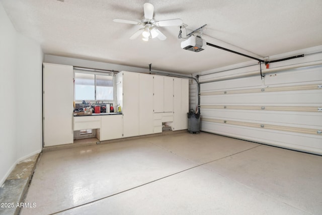 garage featuring a garage door opener and ceiling fan