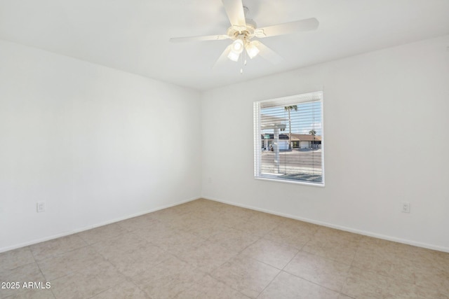 empty room featuring ceiling fan