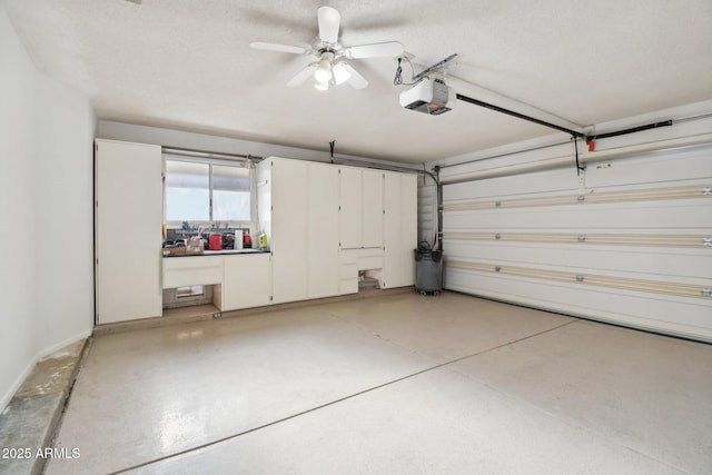 garage featuring ceiling fan and a garage door opener