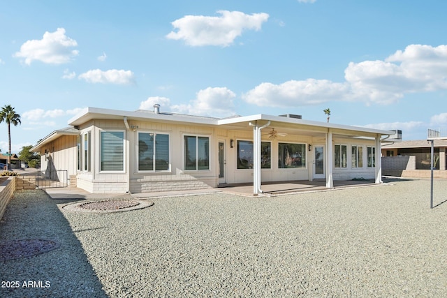 back of property with a patio and ceiling fan