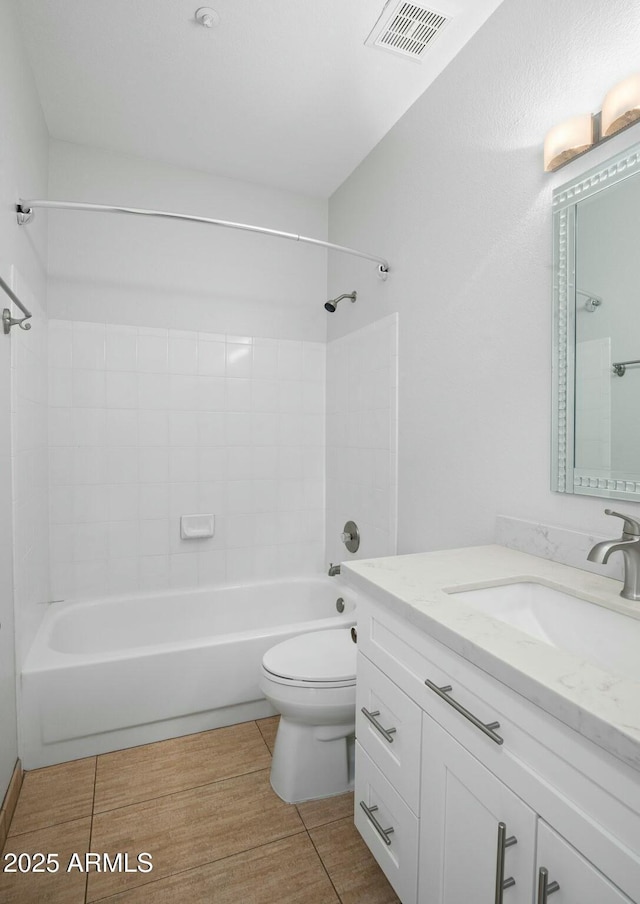 bathroom with visible vents, toilet, shower / bath combination, and vanity