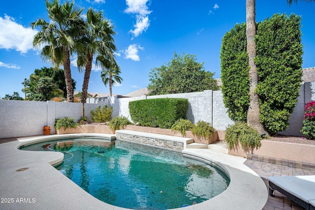 view of pool with a fenced in pool, a patio, and a fenced backyard