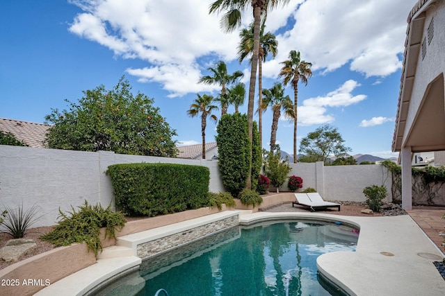 view of swimming pool featuring a fenced in pool and a fenced backyard