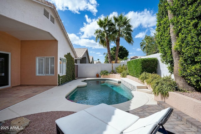 view of swimming pool with a fenced backyard, a fenced in pool, and a patio