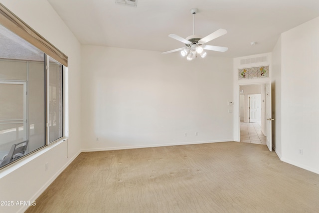 4540 E Mia Ln, Gilbert, AZ 85298 - spare room featuring visible vents, a ceiling fan, baseboards, and light carpet