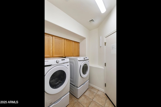 4540 E Mia Ln, Gilbert, AZ 85298 - washroom with light tile patterned flooring, cabinet space, baseboards, visible vents, and independent washer and dryer