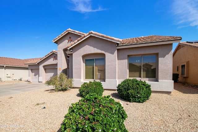 4540 E Mia Ln, Gilbert, AZ 85298 - mediterranean / spanish-style house featuring a garage, a tile roof, concrete driveway, and stucco siding