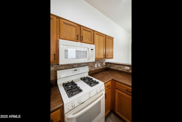 4540 E Mia Ln, Gilbert, AZ 85298 - kitchen with decorative backsplash, brown cabinets, and white appliances