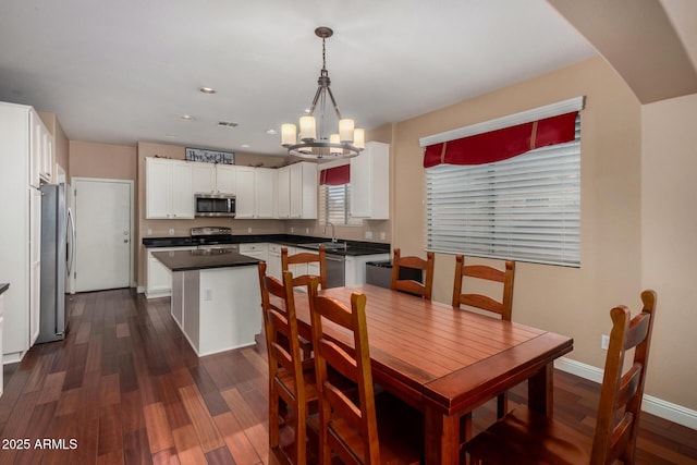 3065 E Harvard Ave, Gilbert, AZ 85234 - dining space with a chandelier, dark wood finished floors, baseboards, and recessed lighting