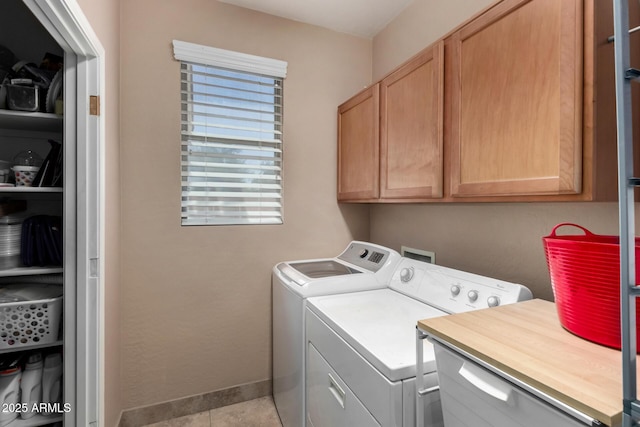 3065 E Harvard Ave, Gilbert, AZ 85234 - clothes washing area with cabinet space, washing machine and clothes dryer, and tile patterned floors