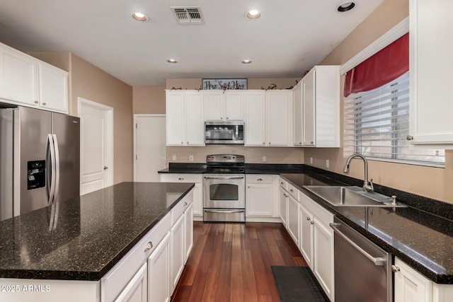 3065 E Harvard Ave, Gilbert, AZ 85234 - kitchen featuring appliances with stainless steel finishes, a sink, dark wood-type flooring, white cabinetry, and recessed lighting