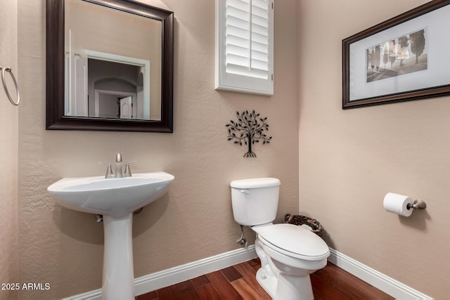 3065 E Harvard Ave, Gilbert, AZ 85234 - half bath with wood finished floors, toilet, and baseboards