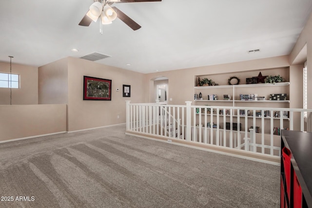 3065 E Harvard Ave, Gilbert, AZ 85234 - carpeted spare room with a ceiling fan, arched walkways, and baseboards