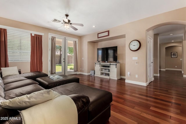 3065 E Harvard Ave, Gilbert, AZ 85234 - living area featuring arched walkways, ceiling fan, dark wood-type flooring, french doors, and baseboards