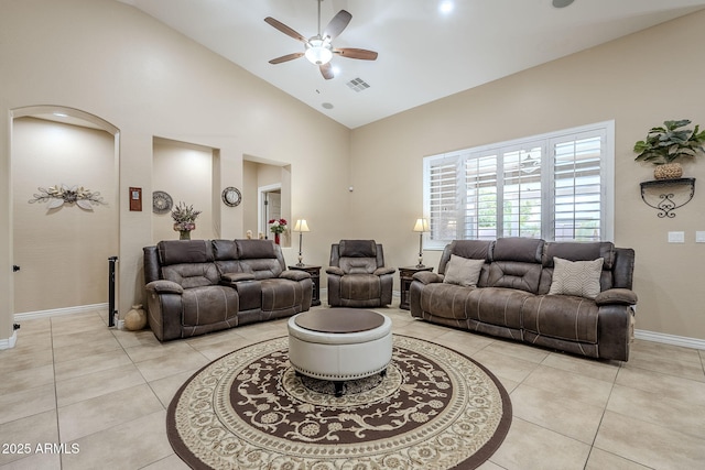 tiled living room featuring high vaulted ceiling and ceiling fan