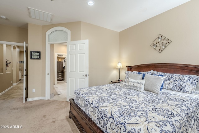 bedroom featuring light carpet