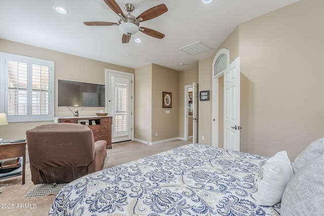 bedroom featuring multiple windows, access to outside, light colored carpet, and ceiling fan