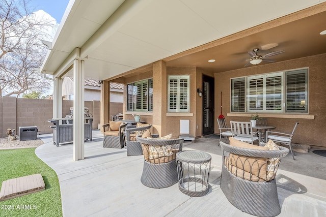 view of patio featuring outdoor lounge area and ceiling fan