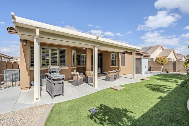 back of property with a patio and a lawn