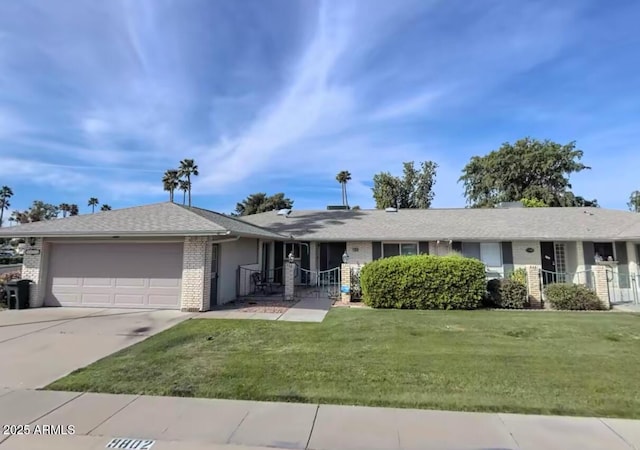 ranch-style house featuring a front yard and a garage