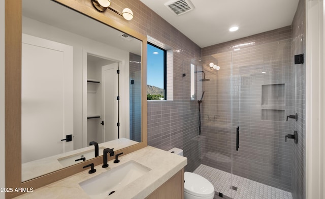4911 E Amelia Ave, Phoenix, AZ 85018 - full bath featuring vanity, a stall shower, toilet, and recessed lighting