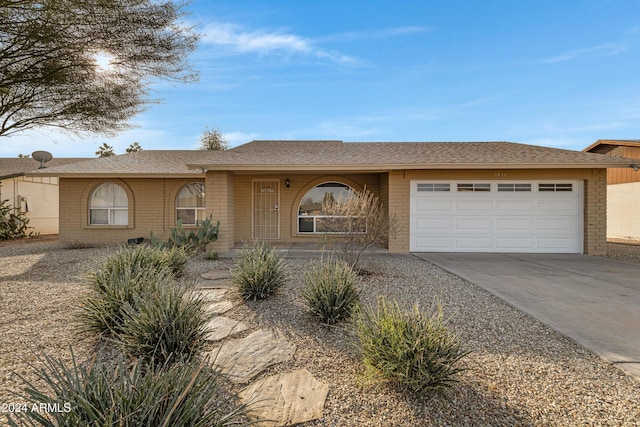 ranch-style home with a garage