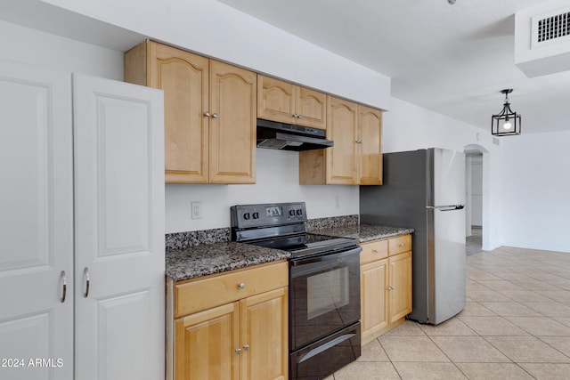 kitchen with hanging light fixtures, light brown cabinetry, black / electric stove, light tile patterned flooring, and stainless steel refrigerator