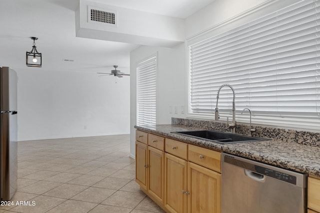 kitchen featuring appliances with stainless steel finishes, ceiling fan, sink, light tile patterned floors, and hanging light fixtures