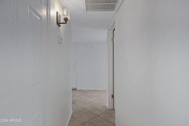 hallway with light tile patterned floors