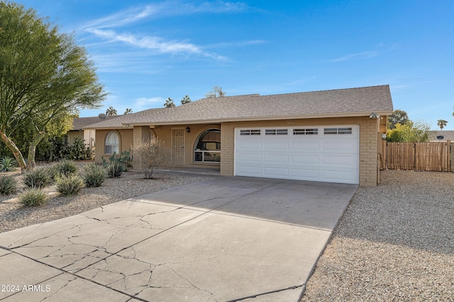 ranch-style home with a garage