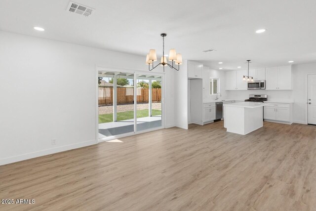 6610 N 15th Ave, Phoenix, AZ 85015 - kitchen featuring a chandelier, stainless steel appliances, visible vents, and recessed lighting
