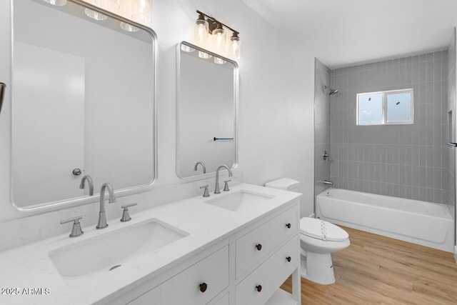 6610 N 15th Ave, Phoenix, AZ 85015 - full bath featuring toilet, wood finished floors, a sink, and bathing tub / shower combination
