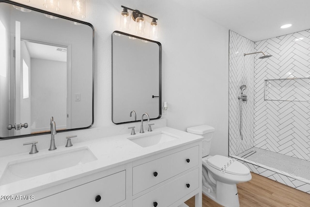 6610 N 15th Ave, Phoenix, AZ 85015 - bathroom with toilet, a sink, double vanity, and tiled shower
