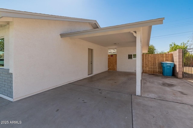 6610 N 15th Ave, Phoenix, AZ 85015 - exterior space featuring fence, concrete driveway, and stucco siding