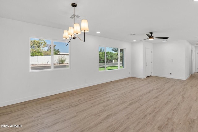6610 N 15th Ave, Phoenix, AZ 85015 - interior space featuring ceiling fan with notable chandelier, light wood-type flooring, baseboards, visible vents, and recessed lighting
