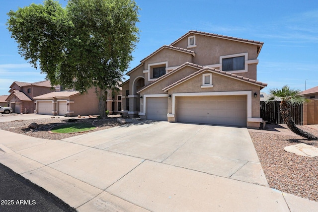 5744 E Jacaranda St, Mesa, AZ 85205 - view of front of house featuring stucco siding, concrete driveway, a garage, and a tiled roof