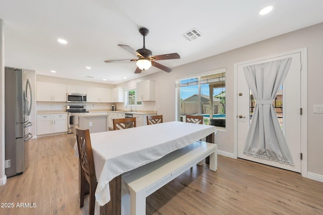 5744 E Jacaranda St, Mesa, AZ 85205 - dining area with light wood-style flooring, recessed lighting, and a ceiling fan