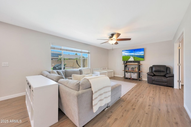 5744 E Jacaranda St, Mesa, AZ 85205 - living area featuring a ceiling fan and light wood-style flooring
