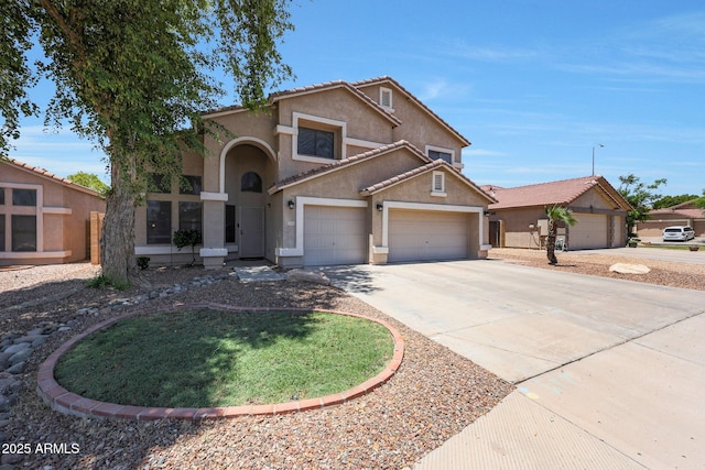 5744 E Jacaranda St, Mesa, AZ 85205 - view of front of property featuring stucco siding, concrete driveway, a garage, and a tiled roof