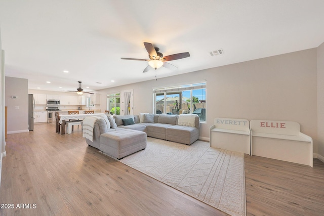 5744 E Jacaranda St, Mesa, AZ 85205 - living area with a ceiling fan, light wood-type flooring, and recessed lighting