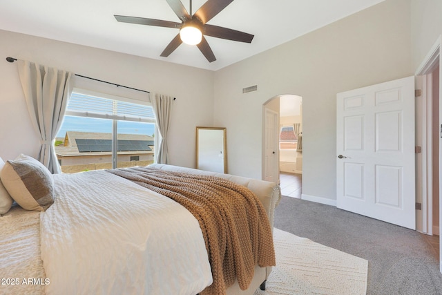5744 E Jacaranda St, Mesa, AZ 85205 - bedroom featuring arched walkways, carpet flooring, and a ceiling fan