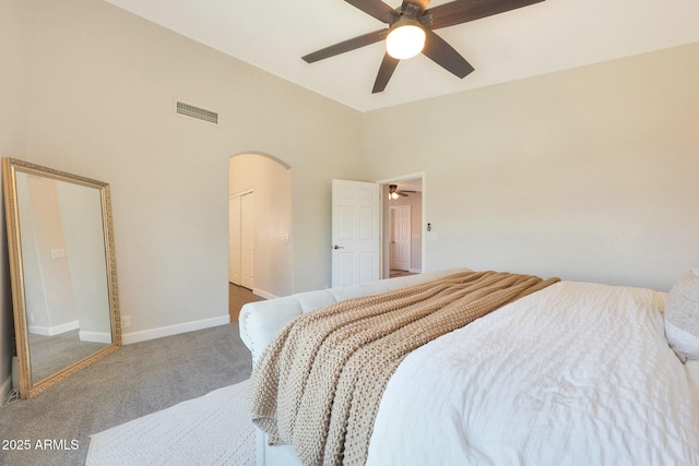 5744 E Jacaranda St, Mesa, AZ 85205 - carpeted bedroom with arched walkways, high vaulted ceiling, ceiling fan, and a closet