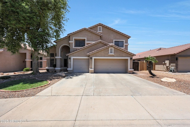 5744 E Jacaranda St, Mesa, AZ 85205 - view of front of house featuring stucco siding, concrete driveway, a garage, and a tiled roof