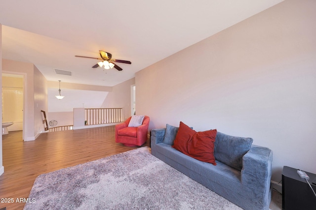 5744 E Jacaranda St, Mesa, AZ 85205 - living area featuring light wood-style flooring and a ceiling fan