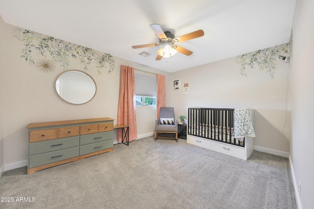 5744 E Jacaranda St, Mesa, AZ 85205 - carpeted bedroom featuring a crib and ceiling fan